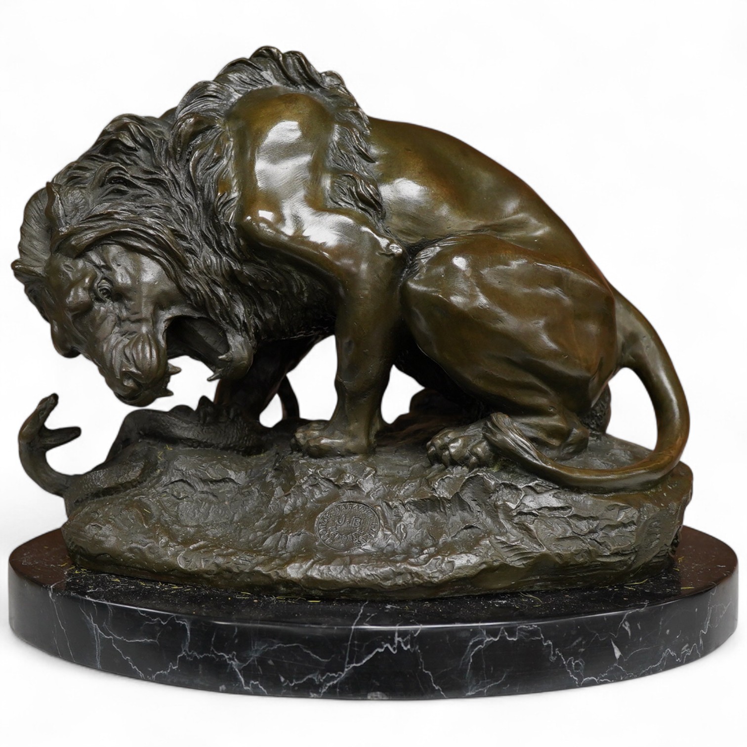 A patinated bronze group of a lion and snake, J.B Paris foundry stamp, signed Coreira, on a black marble base, 23cm high